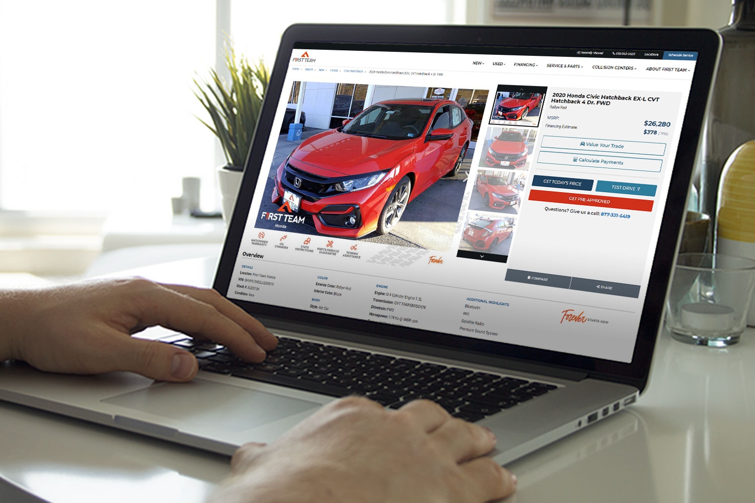Man browsing cars on First Team Auto Group website